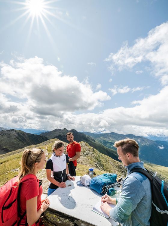 A group at the peak of the Hochkreuzspitze mountain